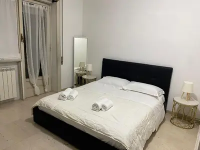 a bedroom with a bed with two towels on it at Scalia gest in Rome