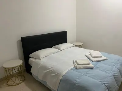a bedroom with a bed with two towels on it at Scalia gest in Rome