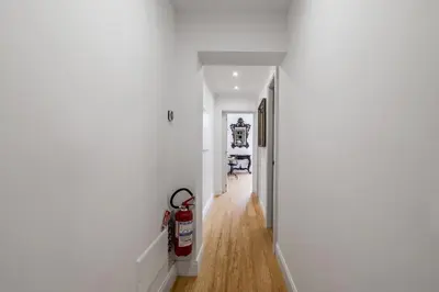 a hallway with a fire extinguisher in a house at Nauta Rome - Comfort e Design in Rome