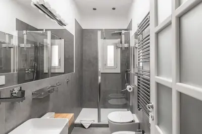 a bathroom with a sink toilet and a shower at Nauta Rome - Comfort e Design in Rome