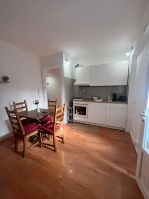 a kitchen and dining room with a table and chairs at Cupola Rooms Vicino al Vaticano in Rome