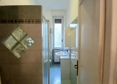 a bathroom with a shower and a sink and a toilet at Casa GattaMelata in Rome