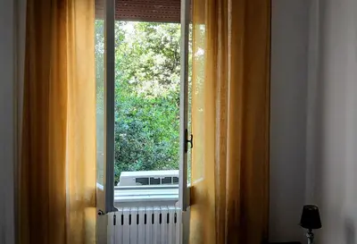 an open window with a view of a radiator at Casa GattaMelata in Rome