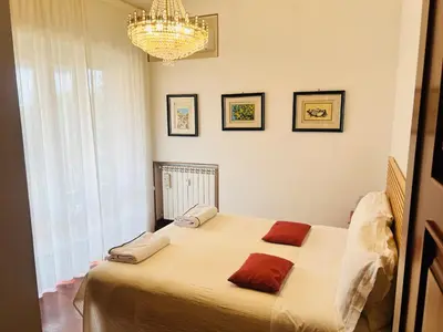 a bedroom with a bed with two pillows on it at I Gerani in Rome
