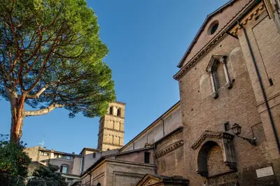 a church with a clock tower in the background at Terrazza Altavista - Aeternum Urbe in Rome