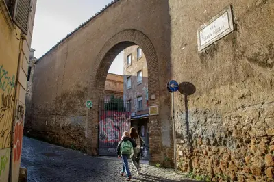 a group of people walking down an alley at Terrazza Altavista - Aeternum Urbe in Rome