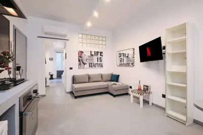 a living room with a couch and a table at Vatican Charming Retreat by NDP rent in Rome