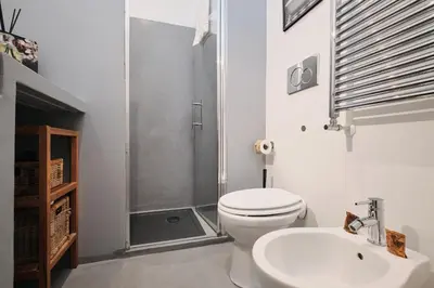 a bathroom with a shower and a toilet and a sink at Vatican Charming Retreat by NDP rent in Rome