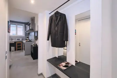 a coat hanging on a wall in a room at Vatican Charming Retreat by NDP rent in Rome