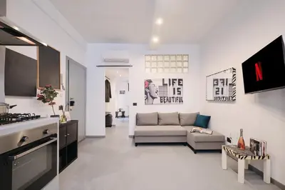 a living room with a couch and a table at Vatican Charming Retreat by NDP rent in Rome