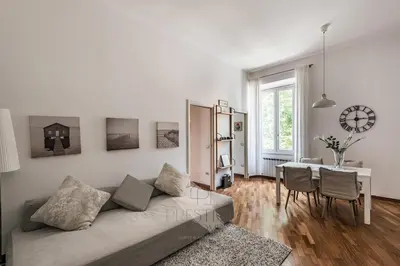 a living room with a couch and a table at Vatican Gallery Apartment in Rome