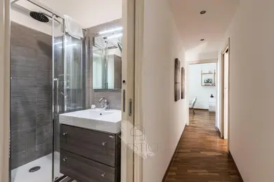 a bathroom with a sink and a shower at Vatican Gallery Apartment in Rome