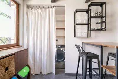 a laundry room with a washer and dryer at Suede Loft Retreat, Charm, Relax Private Parking in Rome