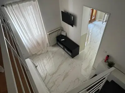 an overhead view of a bathroom with a marble floor at Vacanze Romane in Rome