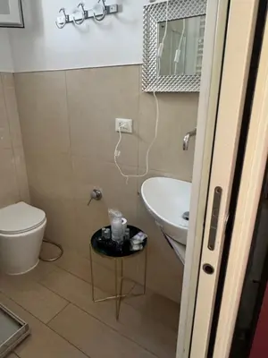 a bathroom with a toilet and a sink at Vacanze Romane in Rome
