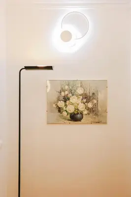 a painting of a vase of flowers on a wall at Casa Pan in Rome