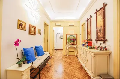 a living room with a couch and blue pillows at Casa Pan in Rome