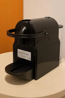 a toaster sitting on top of a table at La Casa del Viaggiatore in Rome