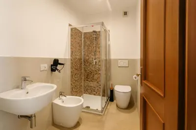 a bathroom with a sink and a shower at La Casa del Viaggiatore in Rome