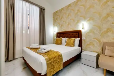 a hotel room with a bed and a chair at Il Rifugio del Re in Rome