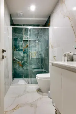 a bathroom with a shower and a toilet and a sink at Il Rifugio del Re in Rome