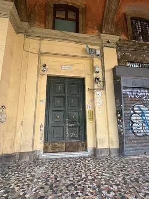 a door on a building with graffiti on it at Il Rifugio del Re in Rome