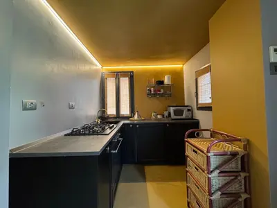 a kitchen with a stove and a counter top at Monti Penthouse in Rome