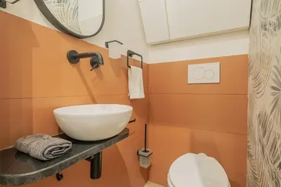a bathroom with a sink and a toilet at MyRentalInn - Vatican Prestigious Apartment in Rome