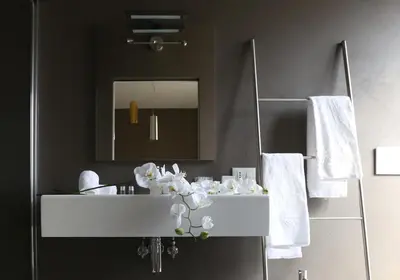 a bathroom with a white sink and a mirror at Residenza Crescenzio in Rome