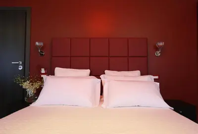 a bedroom with a large bed with white pillows at Residenza Crescenzio in Rome
