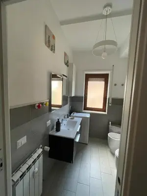 a kitchen with a stove top oven in a kitchen at Marta Cozy place near Vatican and subway in Rome