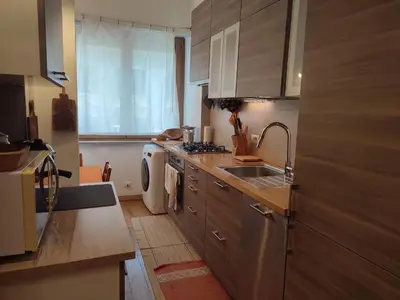 a kitchen with a sink and a washing machine at Tanner's Apartment - Piramide in Rome