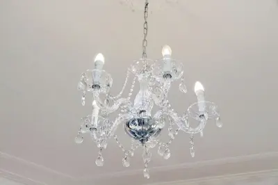 a clear chandelier hanging from a ceiling at Interno 5 elegante residenza per 10 pax vicina a Colosseo e Santa Maria Maggiore in Rome