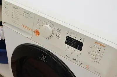 a white washing machine with a control panel at Interno 5 elegante residenza per 10 pax vicina a Colosseo e Santa Maria Maggiore in Rome