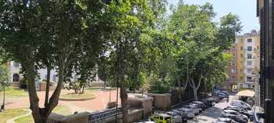a view of a street with cars parked in a parking lot at Interno 5 elegante residenza per 10 pax vicina a Colosseo e Santa Maria Maggiore in Rome