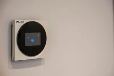 an apple ipod plugged into a wall outlet at New Roman Experience in Rome