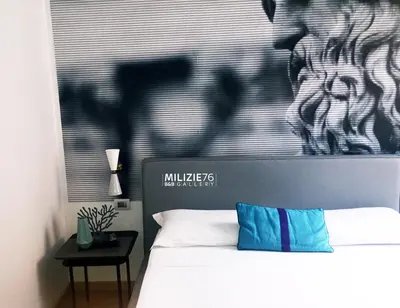 a bedroom with a bed with a picture of a zebra at Milizie 76 Gallery in Rome