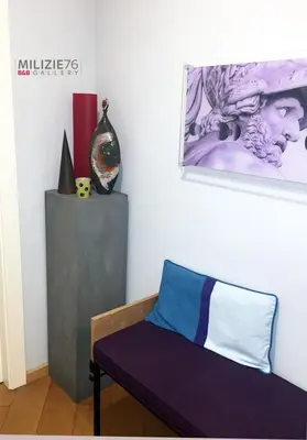 a room with a bench and a painting on the wall at Milizie 76 Gallery in Rome