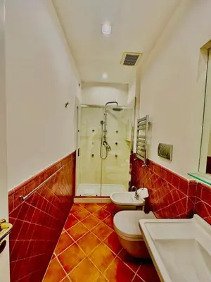 a bathroom with a shower and a toilet and a sink at Fori Imperiali Colosseum in Rome