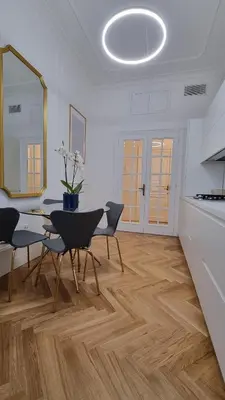a kitchen and dining room with a table and chairs at Beautiful Apartment San Pietro in Rome