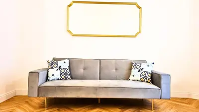 a couch in a living room with a mirror at Beautiful Apartment San Pietro in Rome
