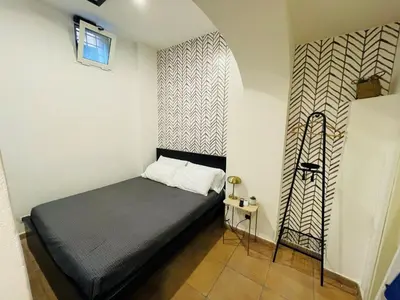 a small bedroom with a bed in a room at Casa Amicitia Piazza di Spagna in Rome