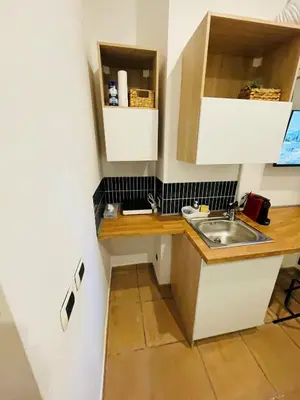 a small kitchen with a sink and a counter at Casa Amicitia Piazza di Spagna in Rome
