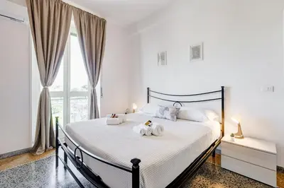 a bedroom with a bed with two stuffed animals on it at L'oasi romana di Daniela in Rome