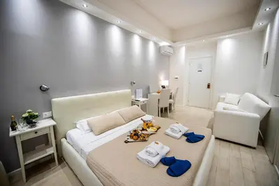 a bedroom with a bed with towels on it at Bella Roma Luxury Accommodation, Vatican City - Liberty Collection in Rome