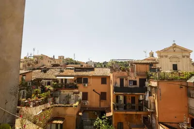 an aerial view of a city with buildings at Trastevere Charming Apartment in Rome