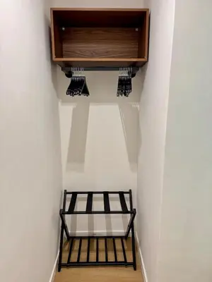 a room with a bed and a cabinet on the wall at Scala 36, Trastevere, Rome in Rome