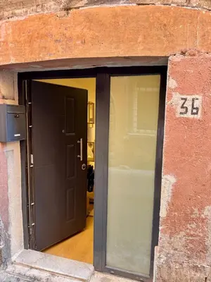 an open garage door with the number behind it at Scala 36, Trastevere, Rome in Rome