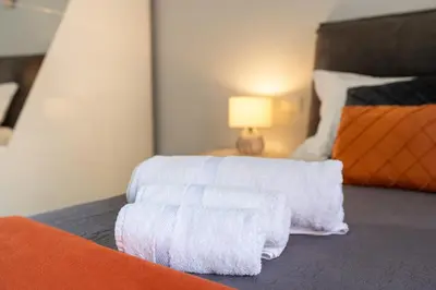 a room with a bed with white towels on it at Imperial House - 300m to Metro B, Open view, 4-6pax in Rome