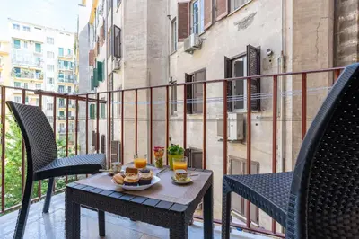 a table with food and drinks on a balcony at Imperial House - 300m to Metro B, Open view, 4-6pax in Rome